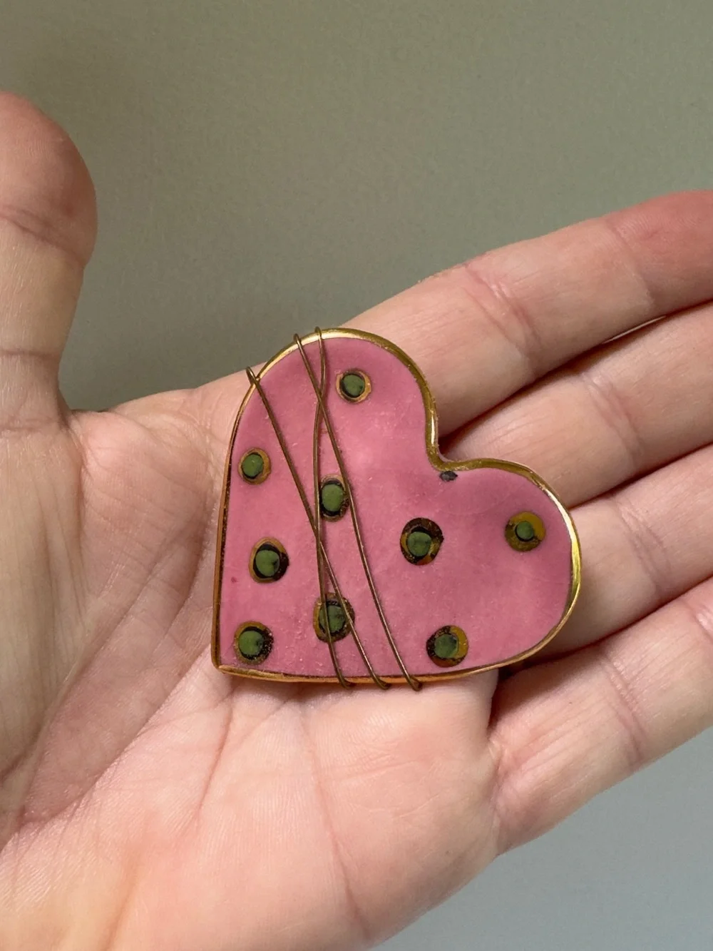 Whimsical Wire Wrapped Pink Heart Enamel Pin with gold trim and Green Dots